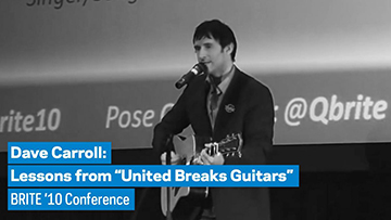 Image of Dave Caroll holding a guitar