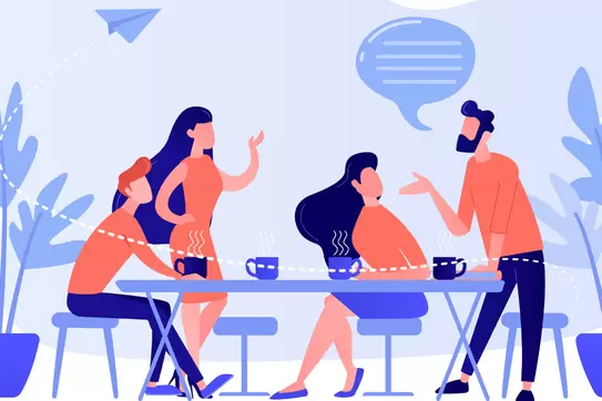 group of people sitting at the table talking
