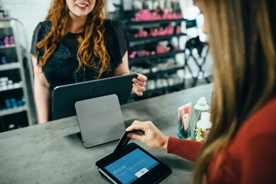 Woman holding magnetic card photo – Free Chip reader. Photo by Blake Wisz on Unsplash