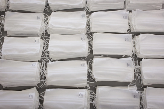 Rows of neatly stacked masks
