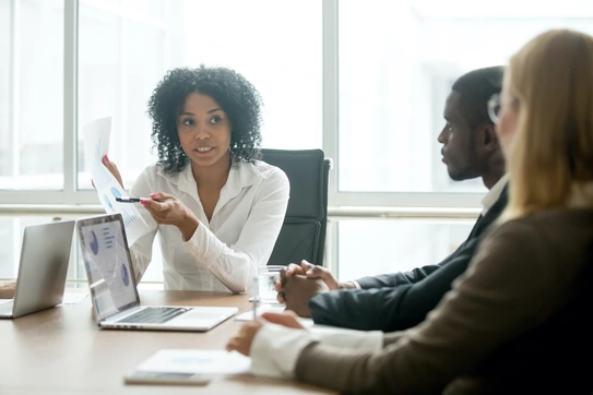 business people talking at conference table