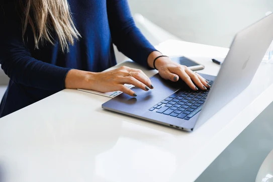Woman typing on computer