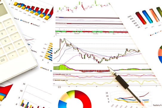Paperwork with colorful data charts and graphs Image
