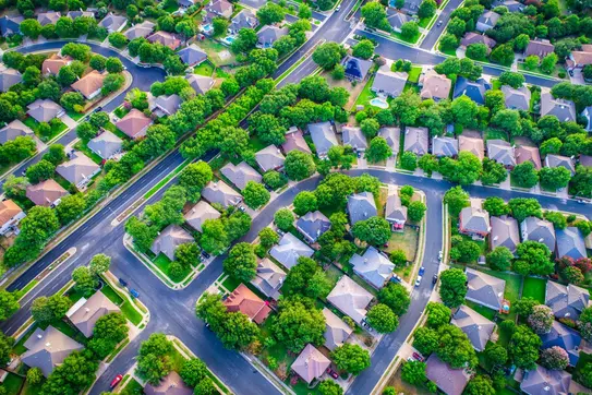 A neighborhood of suburban houses, as seen from above