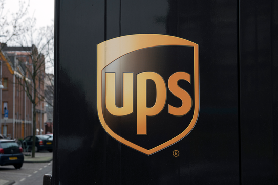 A UPS van with a logo
