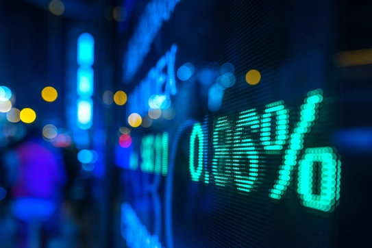 A stock market chart and a city street