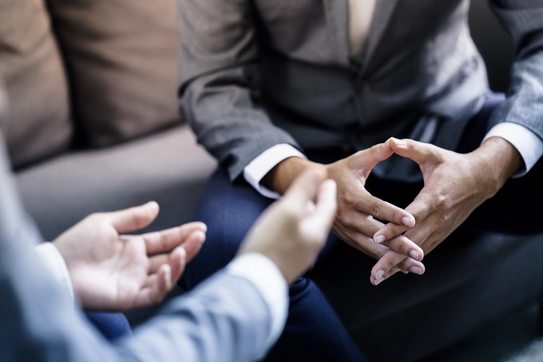 Two people engaged in a negotiation