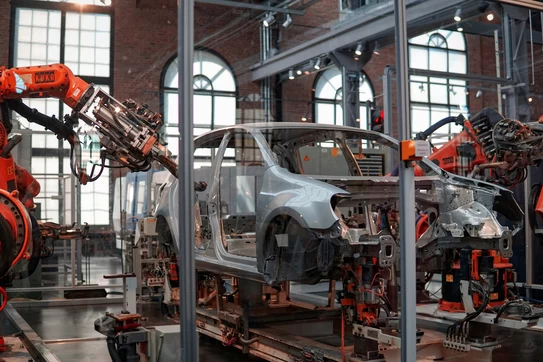 Car being built in a manufacturing warehouse