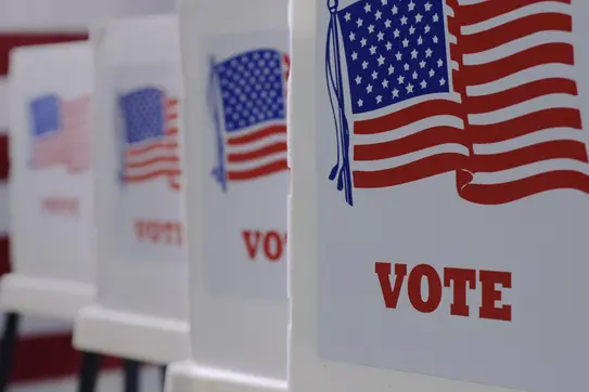voting booths with American flags 