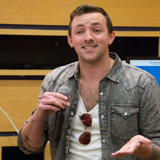 Matt Wilson holding a microphone